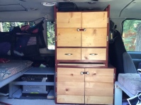 This cabinet maximized our storage behind the driver's seat.